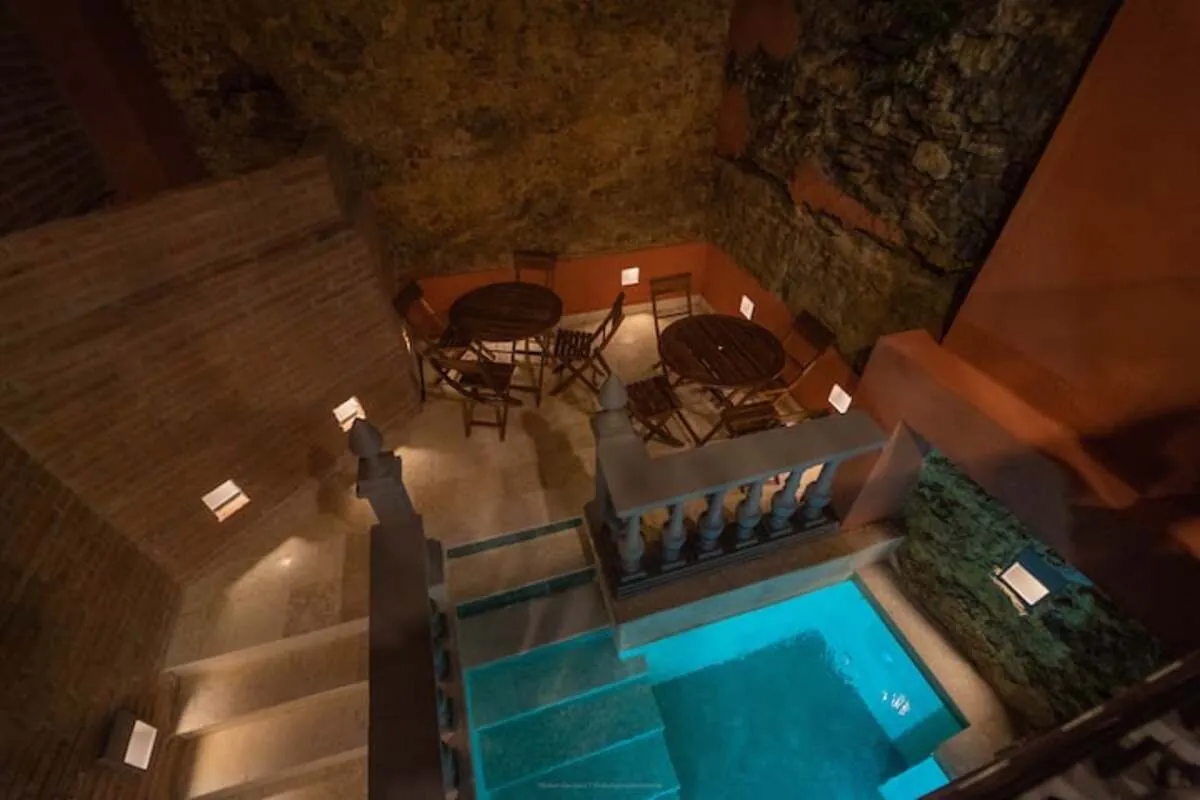 Overhead view of courtyard pool and dining tables